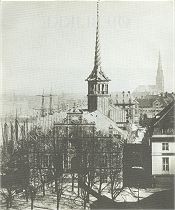 The Stock Exchange with four serpents with green tails like palms up on a high tower